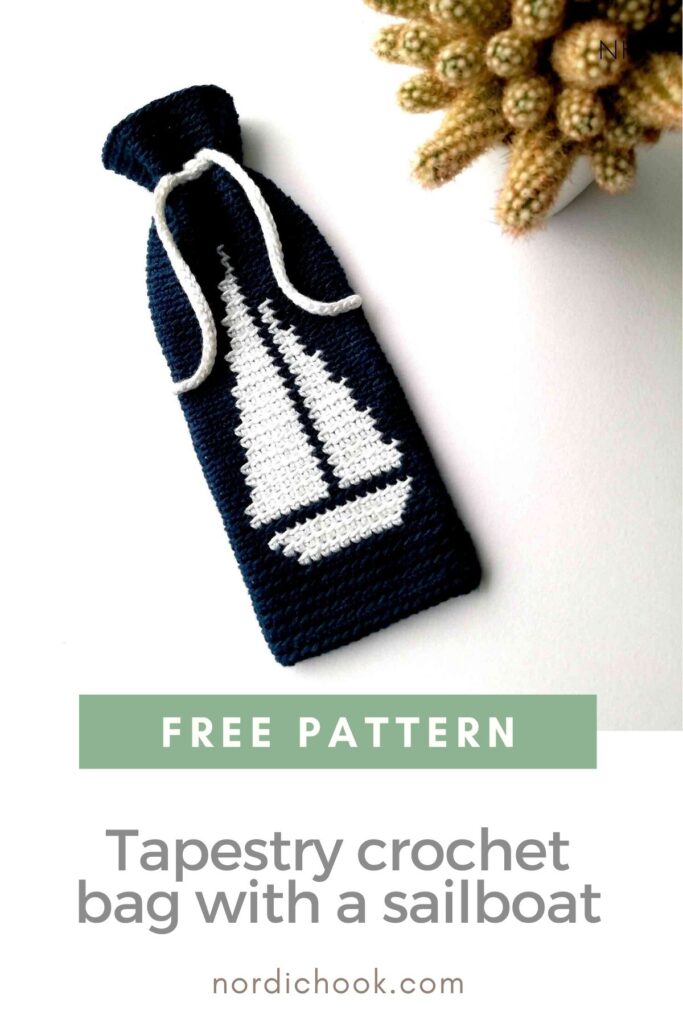 Tapestry crochet drawstring bag with a sailboat