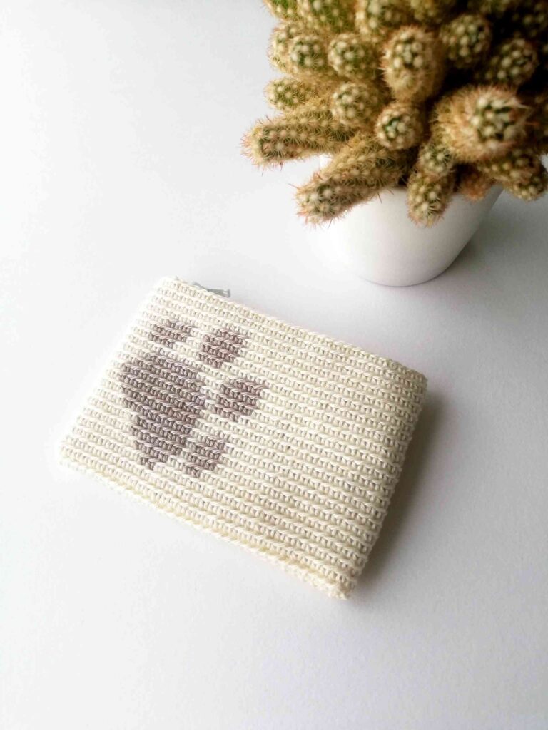 Crochet zipper pouch with a paw print