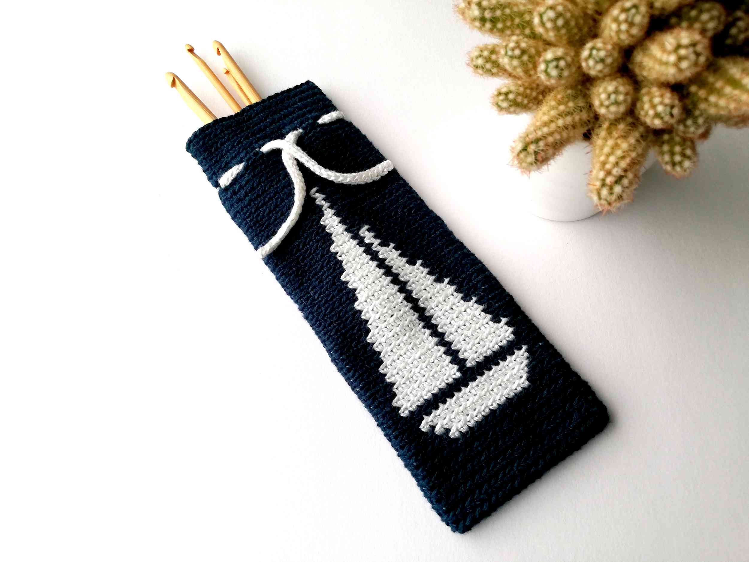 Tapestry crochet drawstring bag with a sailboat