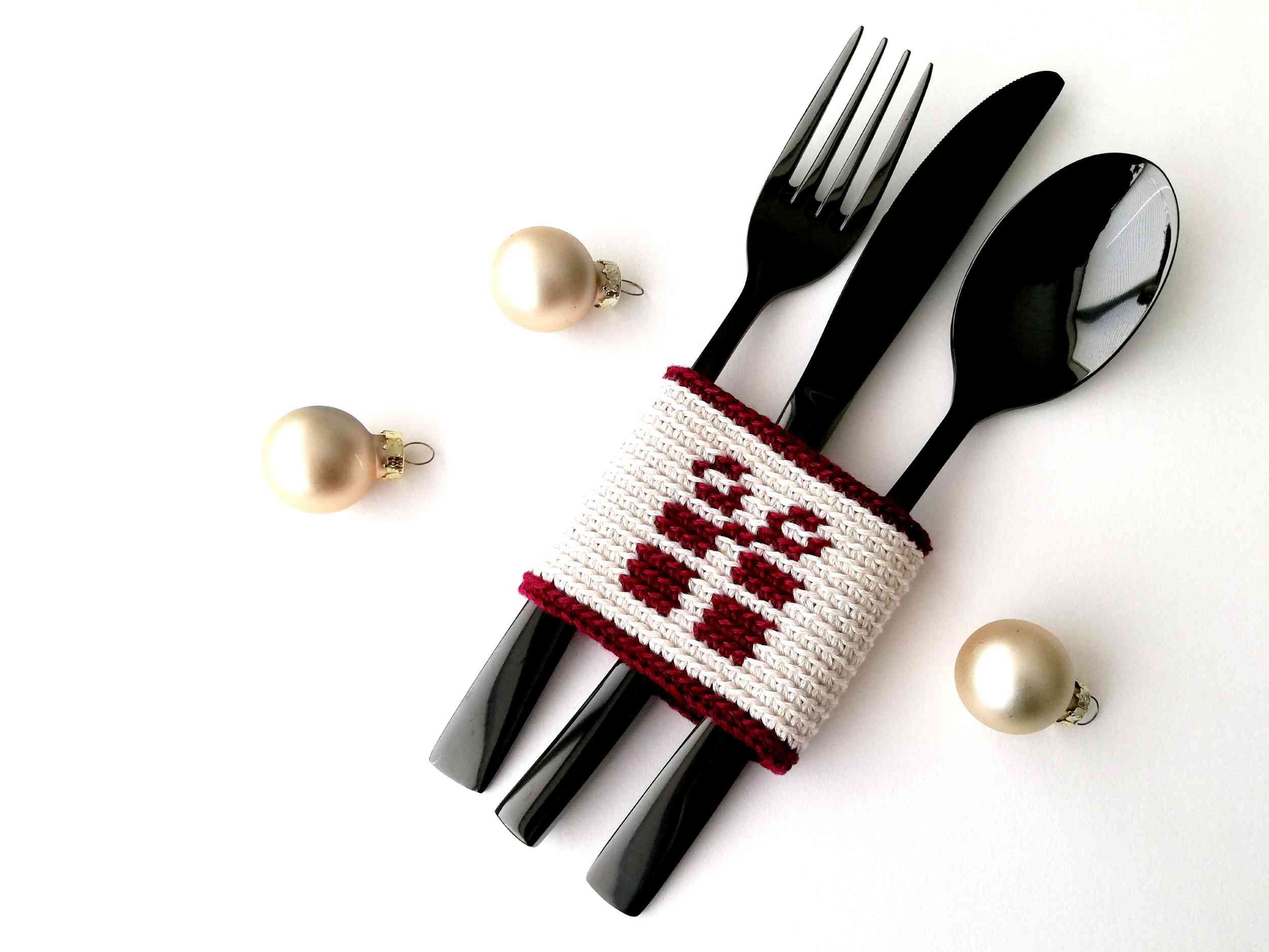 Cutlery holder with a present